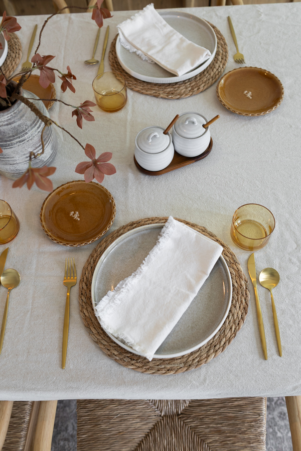 Earthy fall table decor in cream, rust, and warm brown tones for a collected neutral look