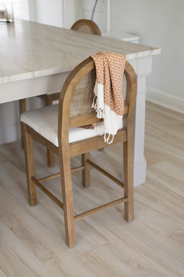 Fall kitchen towel hanging over a kitchen barstool