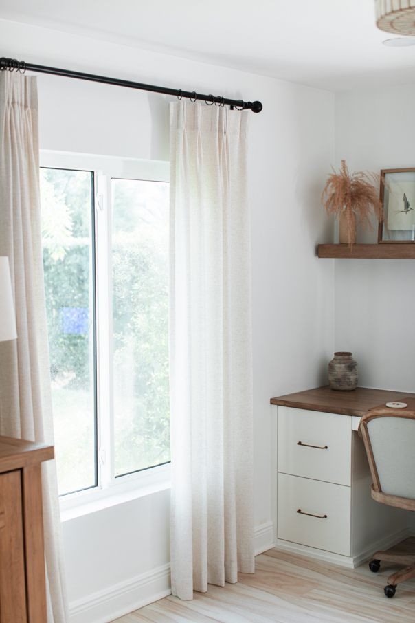 Hanging custom linen curtains hanging in our office on our window