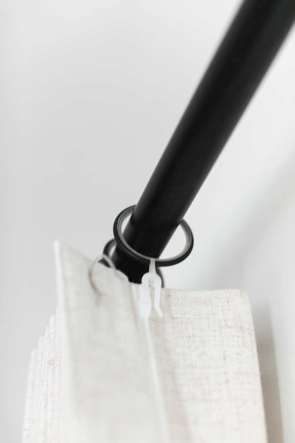 Linen curtains on a black rod
